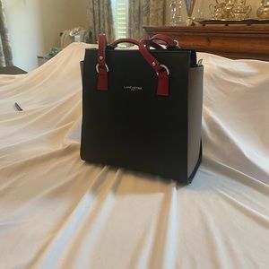 Blue , grey with red straps Lancaster of Paris  bag . Never used